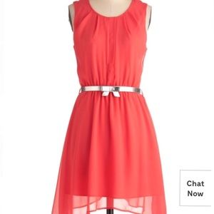 Coral backless dress with silver belt
